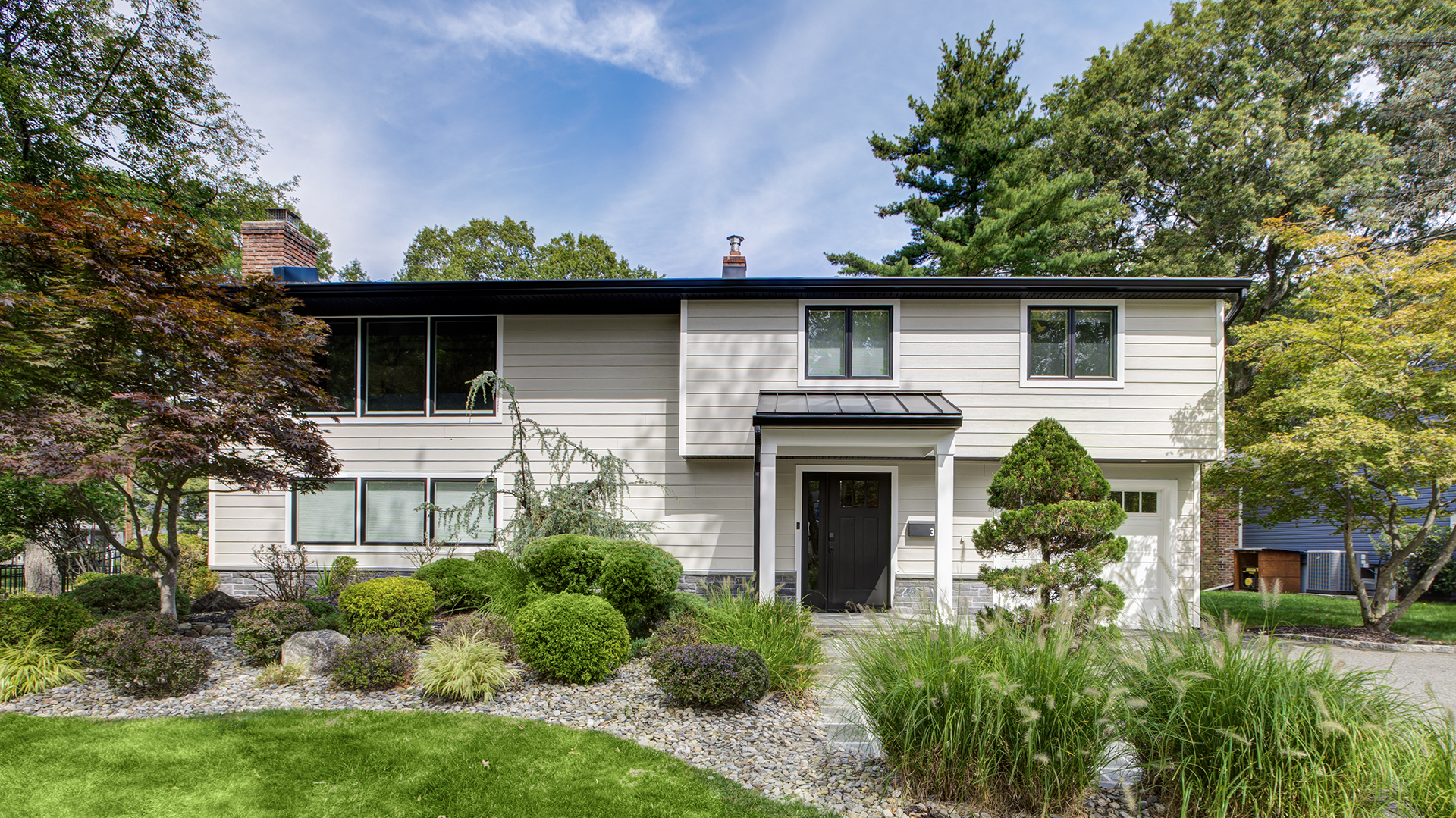 LP SmartSide siding replacement, porch addition, and window upgrades in Livingston, NJ.